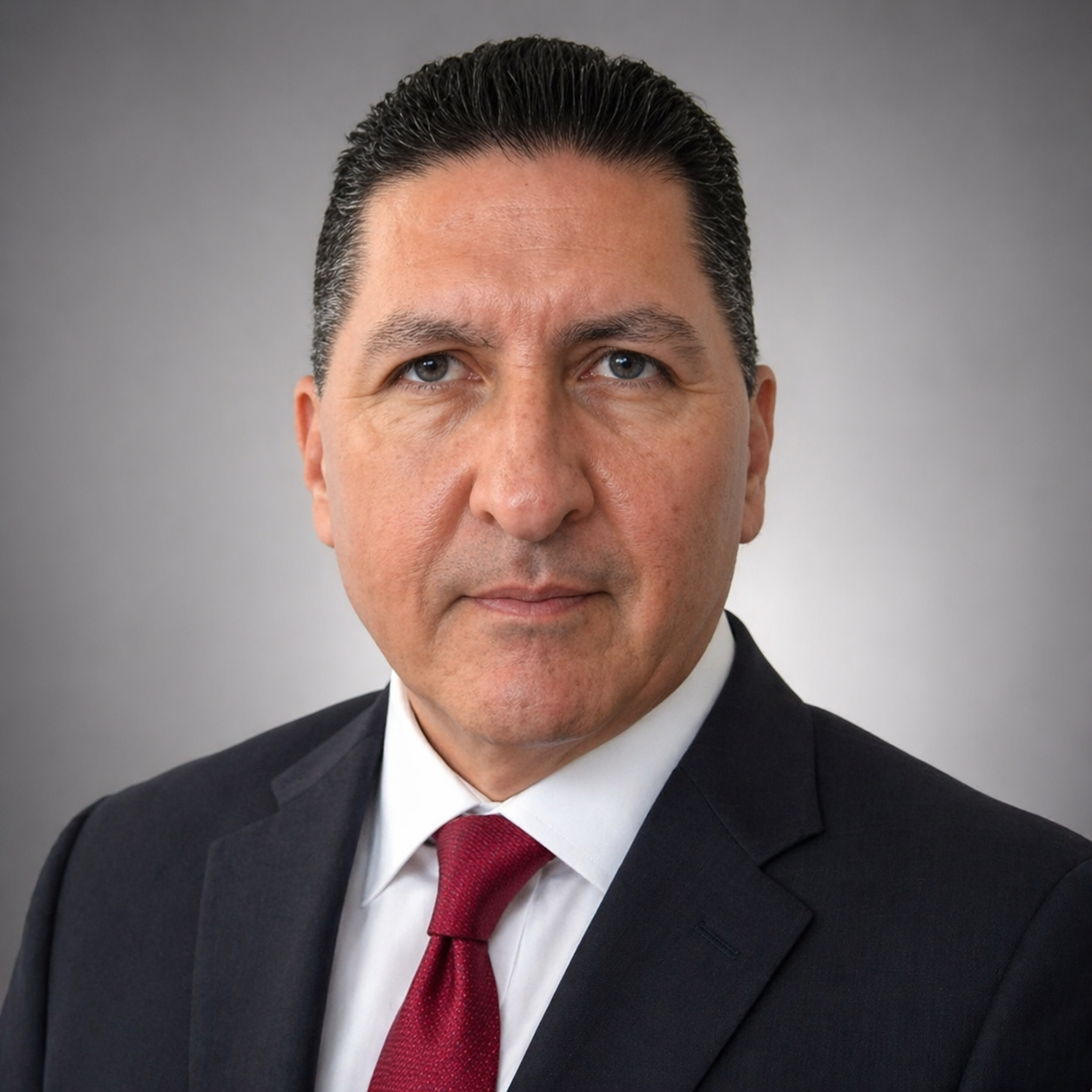 Professional headshot of Ken Carrasco